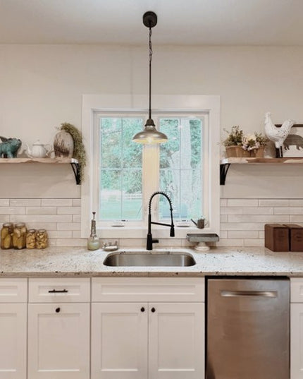 Black metal Niagara Bracket Supports holding natural wood floating shelves in white farmhouse kitchen with subway tile bac...