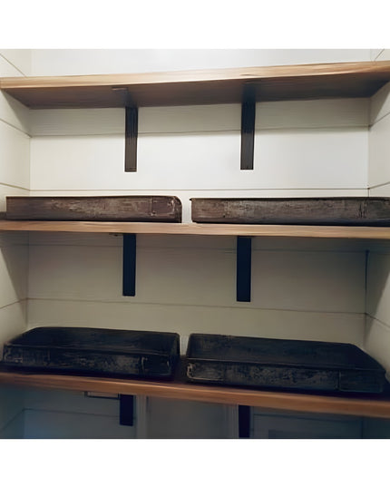 Heavy duty black steel L shelf brackets supporting rustic wooden shelves with vintage wooden boxes in white built-in stora...