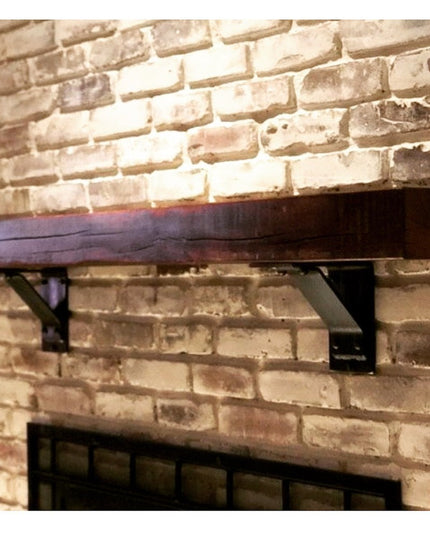 Ithaca Rustic Bracket Support by Industrial Farm Co mounted on exposed brick wall supporting reclaimed wood shelf with dar...