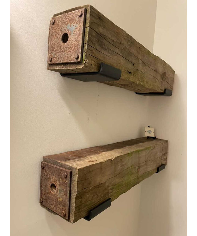 Two rustic wooden shelves mounted on a wall.
