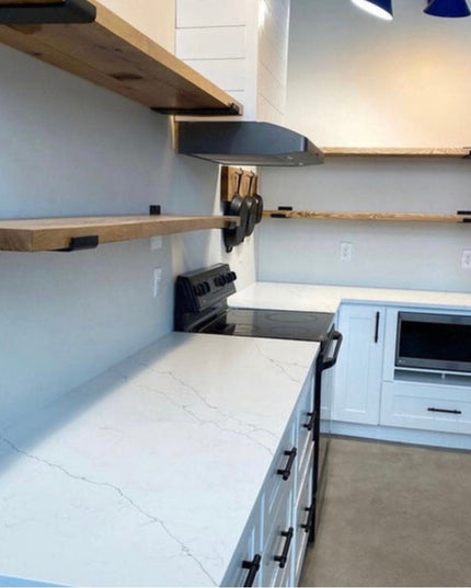 White modern kitchen with floating wood shelves supported by black Dudley 3" steel J brackets from Industrial Farm Co