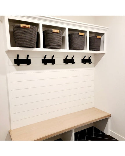 White wooden Fairmount Style Coat Rack by Industrial Farm Co with 4 black hooks, cubby storage baskets, and natural wood b...