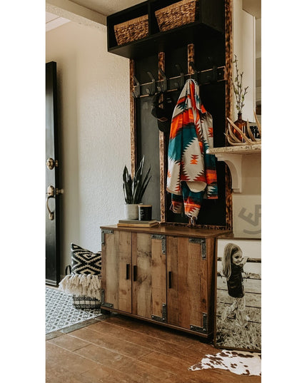 Fairmount Style rustic wooden coat rack with black frame, woven baskets, and metal hooks displaying colorful Native Americ...