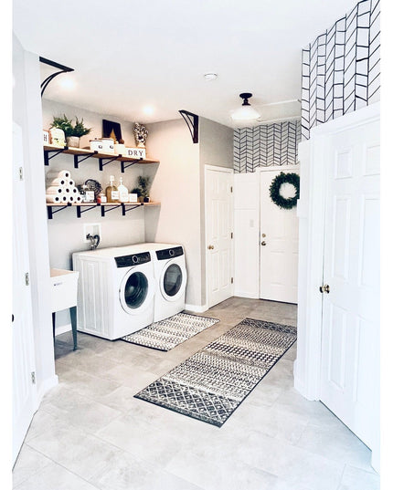 Black metal Nauseef Shelf Support Brackets by Industrial Farm Co supporting wooden shelves in modern laundry room