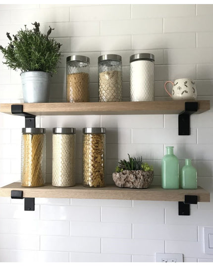 Black metal Auburn Z Open Shelf Support brackets holding natural wood shelves with glass storage jars and plants on white ...