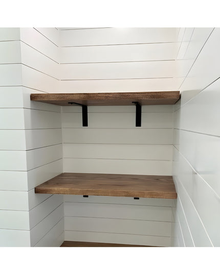 Black steel L-shaped shelf brackets supporting wooden shelves in white shiplap under-stair storage nook - Industrial Farm ...