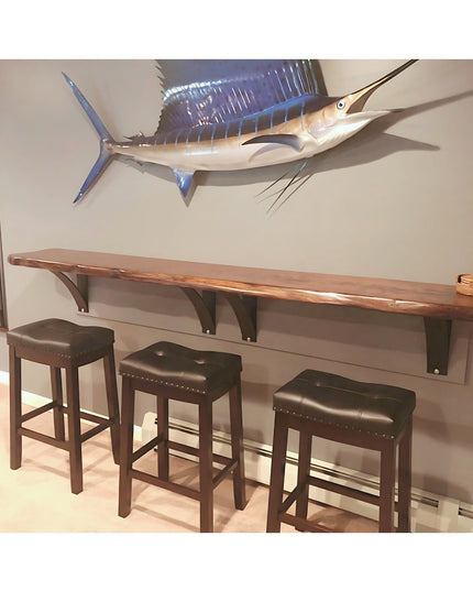 Hattie Style black metal shelf bracket supports mounted under wooden wall shelf with bar stools, Industrial Farm Co hardware