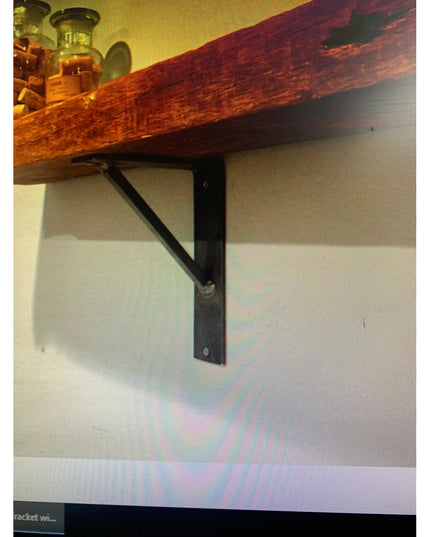 Oneida black metal shelf bracket supporting rustic wood shelf against white wall with decorative bottles, Industrial Farm ...