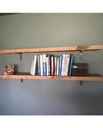 Heavy duty steel L shelf brackets supporting wooden floating shelves with books and decorative items on gray wall