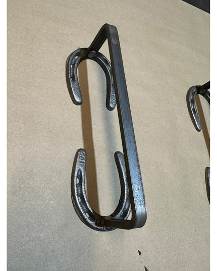Black wrought iron horseshoe door handle by Industrial Farm Co, featuring rustic Chincoteague Pony Shoe design with curved...