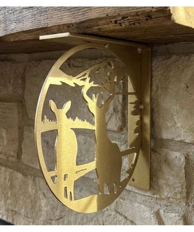 Industrial Farm Co handcrafted golden metal deer landscape L-bracket shelf support mounted on rustic stone wall with woode...