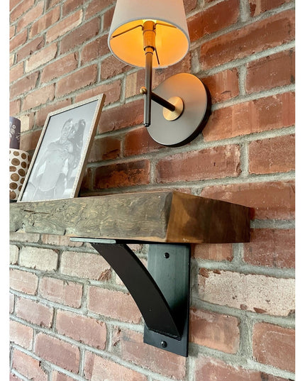 Black steel Albany 4 inch industrial shelf bracket with curved support bar mounted on brick wall supporting reclaimed wood...