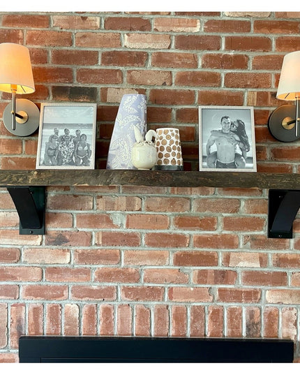Albany industrial steel shelf brackets in black supporting rustic wood shelf on exposed brick wall with sconces and decor ...