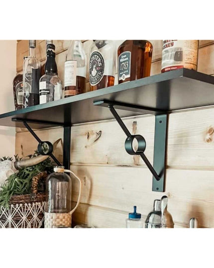 Black metal Glen Cove Modern Shelf Support brackets holding wood shelves with liquor bottles in rustic kitchen bar area by...