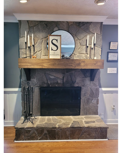 Modern fireplace featuring Industrial Farm Co Eleanor Minimal Steel Brackets supporting rustic wood mantel with stone surr...