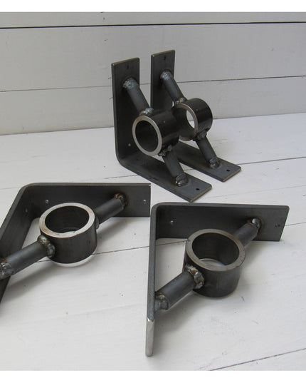 Black metal Glen Cove Modern Shelf Support brackets by Industrial Farm Co with circular pipe holders and L-shaped mounting...