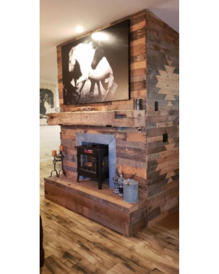 Rustic wood fireplace with reclaimed timber surround, wooden mantel shelf bracket, wood stove, and horse artwork in farmho...