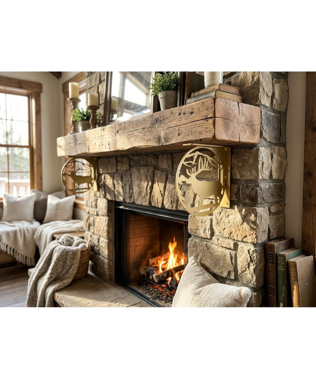 Handcrafted gold metal elk profile L-bracket shelf support mounted on rustic stone fireplace with reclaimed wood mantel by...