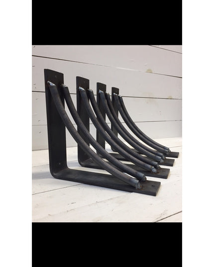 Set of four black metal Niagara Bracket Supports by Industrial Farm Co, featuring curved L-shaped design for rustic shelf ...
