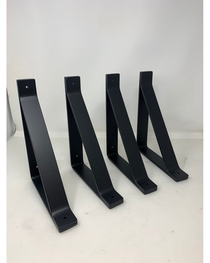 Four black metal Joyce Modern Shelf Support brackets by Industrial Farm Co arranged on white surface, showing sleek L-shap...