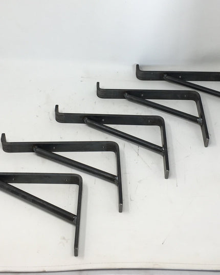 Five black metal Norwich Support Brackets by Industrial Farm Co arranged on white background, showing L-shaped shelf brack...