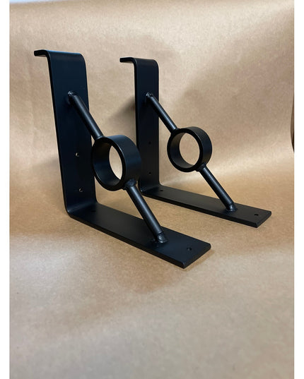 Black metal Simon decorative support brackets by Industrial Farm Co featuring curved rod design with circular rings and L-...