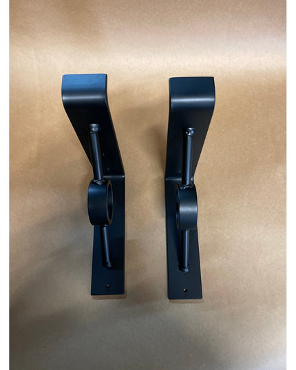 Black metal Simon Decorative Support Brackets by Industrial Farm Co, curved design with mounting holes, shown as pair on w...