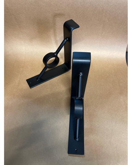 Black metal Simon Decorative Support Brackets by Industrial Farm Co showing two L-shaped corbels with curved design detail...