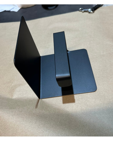 Black metal Cazenovia toilet paper holder with shelf by Industrial Farm Co, featuring modern geometric design with triangu...