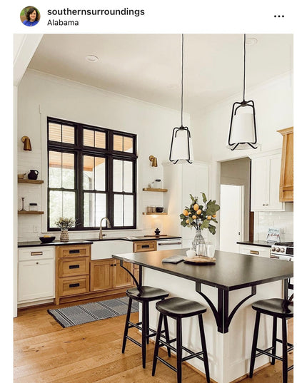 Black metal Syracuse countertop support brackets from Industrial Farm Co holding dark countertop over kitchen island with ...