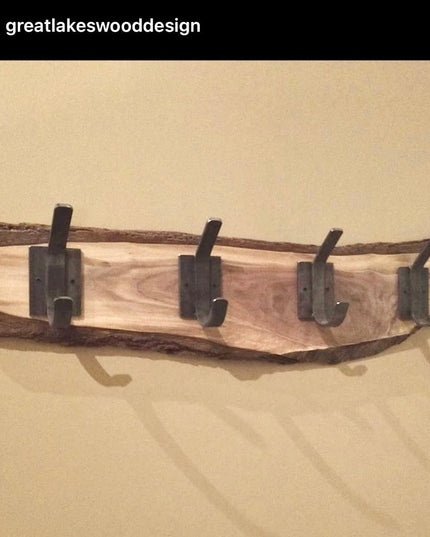 Rustic wooden wall hook rack with live edge wood and four black metal hooks mounted on beige wall - The Elizabeth Wall Hoo...