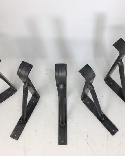 Black metal Nauseef Shelf Support Brackets by Industrial Farm Co, set of 5 triangular wall-mount brackets on white surface