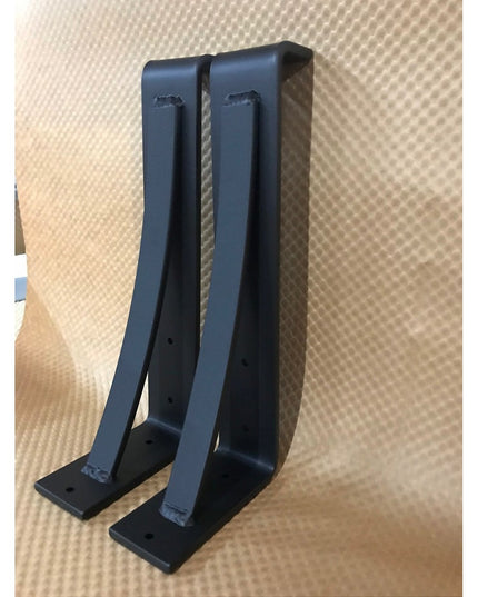 Black metal Saratoga Shelf Support Brackets by Industrial Farm Co, pair of L-shaped corbels with mounting holes on texture...