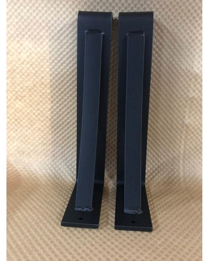 Black steel Saratoga Shelf Support Brackets by Industrial Farm Co, pair of modern minimalist wall-mounted corbels on textu...