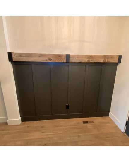 Dark gray wooden beam wrap with natural wood top beam mounted above built-in cabinet storage in modern farmhouse interior ...