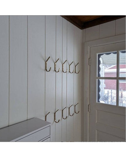 Stewart 1/2" Wide Double Hooks in bronze finish mounted on white vertical wood paneling in mudroom entryway by Industrial ...