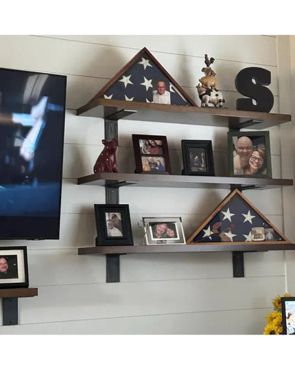 Heavy duty black steel shelf brackets supporting wooden shelves displaying military flag cases and family photos on white ...