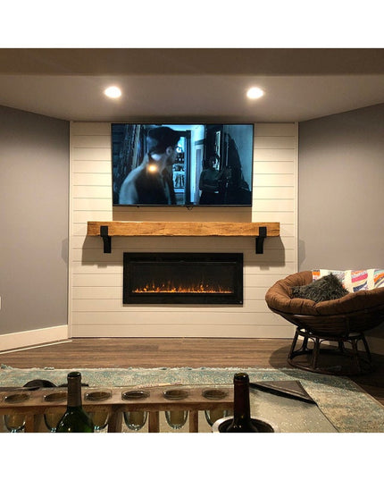 Black metal Seneca 3" Farmhouse Mantel Brackets supporting rustic wood mantel above modern fireplace with white shiplap wall
