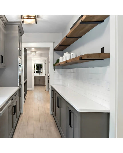 Industrial Farm Co Jane J Style black metal shelf brackets supporting natural wood floating shelves in modern farmhouse ki...