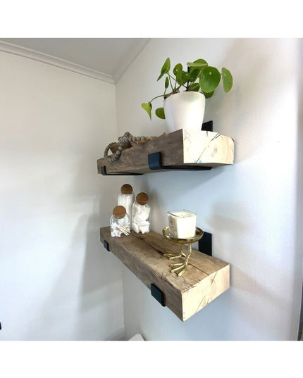 Black metal shelf brackets supporting rustic wooden floating shelves with white ceramic plant pot and glass jars - The Jan...