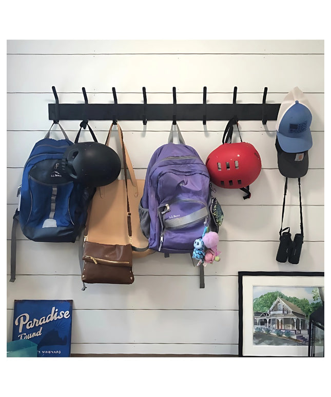 Black Cooperstown Double Hook Coat Rack by Industrial Farm Co mounted on white shiplap wall holding backpacks, bags, helme...