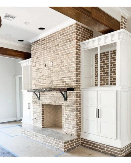 Heavy duty steel Albany 4" Industrial Shelf Bracket with curved support bar mounted on brick fireplace with white cabinetry