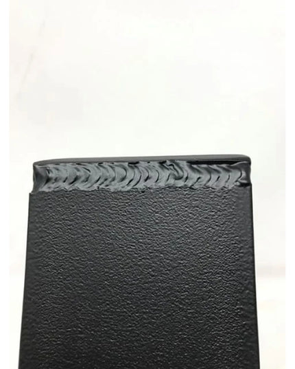 Black steel Eleanor Minimal Steel Bracket by Industrial Farm Co showing welded seam detail and textured powder coat finish...