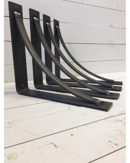 Four black steel Pops 2" industrial shelf brackets by Industrial Farm Co with curved support bars and mounting holes, disp...