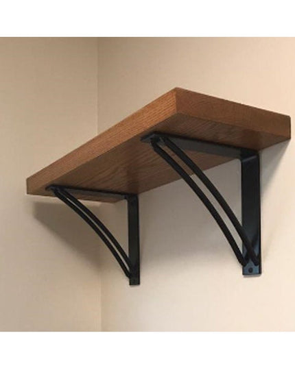 The Niagara Bracket Support by Industrial Farm Co - black metal triangular shelf brackets supporting wood shelf on wall