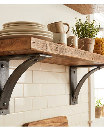 Industrial Farm Co Moravia 4" black metal shelf brackets with rivets supporting reclaimed wood shelves displaying ceramic ...