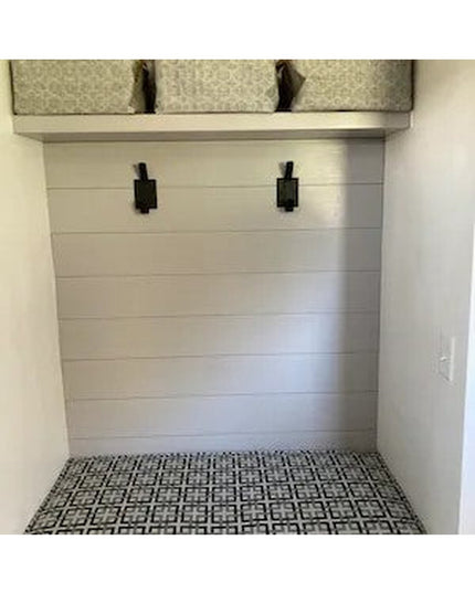 Black iron Elizabeth Wall Hooks by Industrial Farm Co mounted on white shiplap wall above patterned tile bench in mudroom ...
