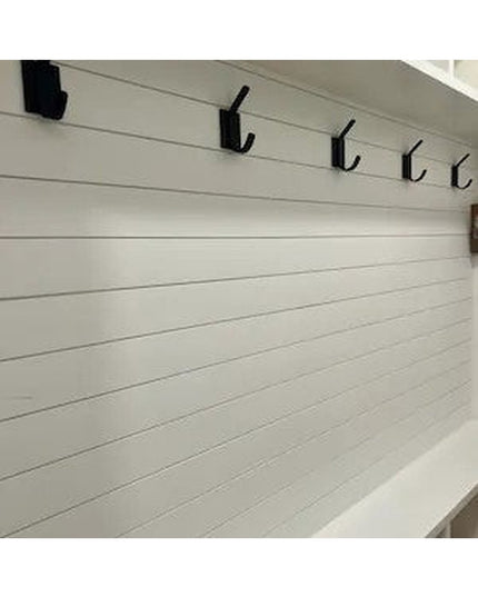 Black metal Elizabeth Wall Hooks by Industrial Farm Co mounted on white shiplap wall showing modern farmhouse style coat h...