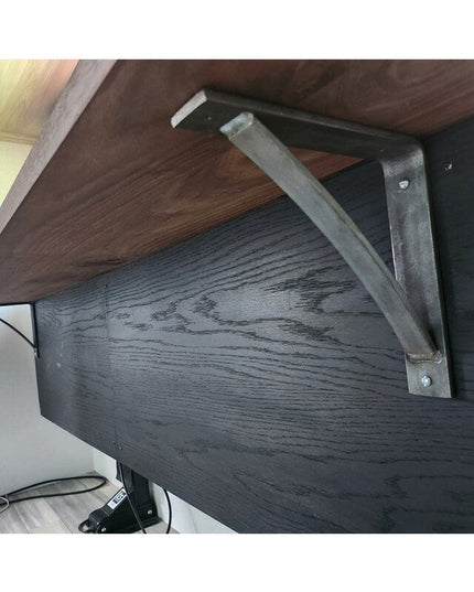Black steel Pops 2 inch industrial shelf bracket with curved support bar mounted under dark wood shelf by Industrial Farm Co