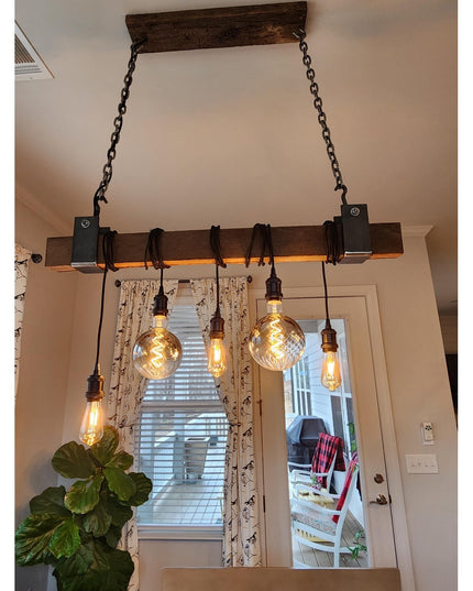 Santa Fe Beam Wrap by Industrial Farm Co featuring rustic wood beam with black metal brackets and Edison bulb pendant ligh...
